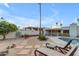 Inviting backyard featuring a sparkling pool, lounge chairs and desert landscaping at 11041 N 44Th St, Phoenix, AZ 85028