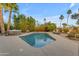 Sparkling pool and spa surrounded by lush landscaping create a backyard oasis at 11041 N 44Th St, Phoenix, AZ 85028