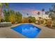 Backyard pool with hot tub and desert landscaping at sunset at 11041 N 44Th St, Phoenix, AZ 85028