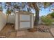 Backyard shed in landscaped back yard with rock borders at 11041 N 44Th St, Phoenix, AZ 85028