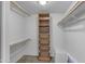 Spacious walk-in closet with shelving and wire baskets for optimal organization at 11041 N 44Th St, Phoenix, AZ 85028