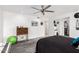 Spacious bedroom featuring soft carpet, fan, and a dresser at 11139 W Cameo Dr, Sun City, AZ 85351