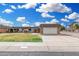 Inviting single-story home featuring a well-manicured lawn and an attached two-car garage at 11139 W Cameo Dr, Sun City, AZ 85351