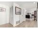 Bright hallway with tiled flooring, connecting to the living area with comfortable seating at 11139 W Cameo Dr, Sun City, AZ 85351