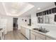 Well-lit kitchen with a white countertop, double sink, and modern dishwasher at 11139 W Cameo Dr, Sun City, AZ 85351