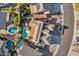 Expansive aerial view of the property showcasing the pool, lush landscaping, and solar panels at 11256 S Hopi Dr, Goodyear, AZ 85338