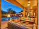 A beautiful backyard featuring covered patio, swimming pool and outdoor seating areas at 11256 S Hopi Dr, Goodyear, AZ 85338