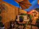 Cozy backyard with a bench, decorative lights, and lush greenery, perfect for relaxation at 11256 S Hopi Dr, Goodyear, AZ 85338