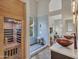 Spacious bathroom featuring a sauna, glass shower, and vanity with vessel sinks at 11256 S Hopi Dr, Goodyear, AZ 85338