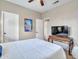 Bedroom featuring a neatly made bed, a mounted TV, and neutral-colored walls at 11256 S Hopi Dr, Goodyear, AZ 85338