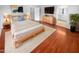 Cozy main bedroom featuring hardwood floors and modern decor for a comfortable retreat at 12163 W Chase Ln, Avondale, AZ 85323