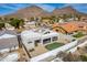 Aerial view of a desert home, highlighting the backyard putting green and desert landscape at 1219 E Seminole Dr, Phoenix, AZ 85022