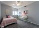 Bedroom with carpet flooring, ceiling fan, and natural light at 1219 E Seminole Dr, Phoenix, AZ 85022