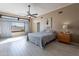 Bright main bedroom features light wood floors, recessed lighting, and modern ceiling fan at 1219 E Seminole Dr, Phoenix, AZ 85022