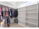 Walk-in closet with built-in shelving and hanging racks at 1219 E Seminole Dr, Phoenix, AZ 85022