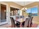 Formal dining room boasting scenic views and a large table with stylish chairs at 13719 W Creosote Dr, Peoria, AZ 85383