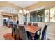 Dining area with wood table, seating for eight, and ample natural light at 13719 W Creosote Dr, Peoria, AZ 85383