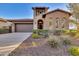 Charming single-Gathering home with desert landscaping, attached garage, and a well-maintained front yard at 13719 W Creosote Dr, Peoria, AZ 85383