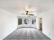 Bright bedroom with multiple windows, a ceiling fan, and neutral carpet flooring at 1405 E Cathedral Rock Dr, Phoenix, AZ 85048