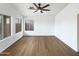 Bright living room with ceiling fan and a view of the backyard at 1405 E Cathedral Rock Dr, Phoenix, AZ 85048