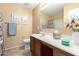 Bathroom with a single sink, framed mirror, and decorative accents at 1458 N 80Th Ln, Phoenix, AZ 85043