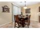 Dining room with wooden table and natural light at 1458 N 80Th Ln, Phoenix, AZ 85043