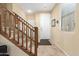 Bright foyer with staircase and tiled flooring at 1458 N 80Th Ln, Phoenix, AZ 85043