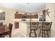 Kitchen with breakfast bar and pendant lighting at 1458 N 80Th Ln, Phoenix, AZ 85043