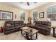 Cozy living room featuring tile floors, ceiling fan and two windows at 1458 N 80Th Ln, Phoenix, AZ 85043