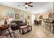 Inviting living room open to dining area, perfect for entertaining at 1458 N 80Th Ln, Phoenix, AZ 85043