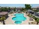 Aerial view of a resort-style pool featuring a hot tub, lounge chairs, and a gazebo in a gated community at 1458 N 80Th Ln, Phoenix, AZ 85043