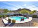 Beautiful backyard featuring a refreshing pool, landscaping, and mountain views at 1515 E Sunnyslope Ln, Phoenix, AZ 85020