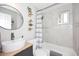 Modern bathroom featuring a sink, toilet, and a tiled shower-tub combination at 1515 E Sunnyslope Ln, Phoenix, AZ 85020