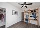 Functional bedroom featuring hardwood floors, a closet, and a built-in desk with shelving at 1515 E Sunnyslope Ln, Phoenix, AZ 85020