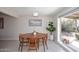 Charming dining area featuring a round wooden table and view of the outdoor patio at 1515 E Sunnyslope Ln, Phoenix, AZ 85020