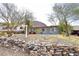 Single-story home with desert landscaping, including a cactus, rock accents, and a vibrant yellow door at 1515 E Sunnyslope Ln, Phoenix, AZ 85020