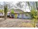 Single-story home featuring desert landscaping and a vibrant yellow door, situated with mountain views at 1515 E Sunnyslope Ln, Phoenix, AZ 85020