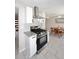 Modern kitchen showcasing stainless steel appliances, white cabinetry, and an adjacent dining area at 1515 E Sunnyslope Ln, Phoenix, AZ 85020