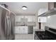 Modern kitchen featuring stainless steel appliances, granite countertops, and subway tile backsplash at 1515 E Sunnyslope Ln, Phoenix, AZ 85020