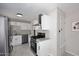 Well-lit kitchen with stainless steel appliances, granite countertops, and modern white cabinetry at 1515 E Sunnyslope Ln, Phoenix, AZ 85020