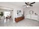 Open-concept living space with tile floors, mid-century modern furniture, and dining area view at 1515 E Sunnyslope Ln, Phoenix, AZ 85020