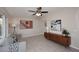 Bright living room featuring tile floors, modern art, and a comfortable gray sofa at 1515 E Sunnyslope Ln, Phoenix, AZ 85020