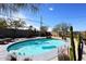 Gorgeous pool featuring sunny blue water and a refreshing in-ground design, surrounded by greenery at 1515 E Sunnyslope Ln, Phoenix, AZ 85020