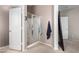 Bathroom features a glass-enclosed shower, soft towels and modern design at 16036 N 11Th Ave # 1126, Phoenix, AZ 85023