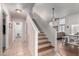 Inviting entryway featuring tile flooring, stairs with decorative risers, and an open view into the living area at 16036 N 11Th Ave # 1126, Phoenix, AZ 85023