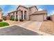 Inviting two-story home with a two-car garage, xeriscaping, and mature landscaping at 16036 N 11Th Ave # 1126, Phoenix, AZ 85023