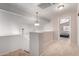 Upstairs loft area with neutral carpet and paint and a pendant light fixture in a modern design at 16036 N 11Th Ave # 1126, Phoenix, AZ 85023