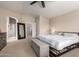 Bedroom with neutral walls and carpet, featuring a king bed and views to the ensuite bath at 16036 N 11Th Ave # 1126, Phoenix, AZ 85023