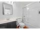 Full bathroom features a shower-tub combo with a sliding glass door and a modern vanity with a vessel sink at 16618 S 28Th Pl, Phoenix, AZ 85048