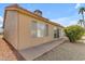 Home exterior featuring a covered patio area and desert-friendly landscaping at 1706 E Lindrick Dr, Chandler, AZ 85249